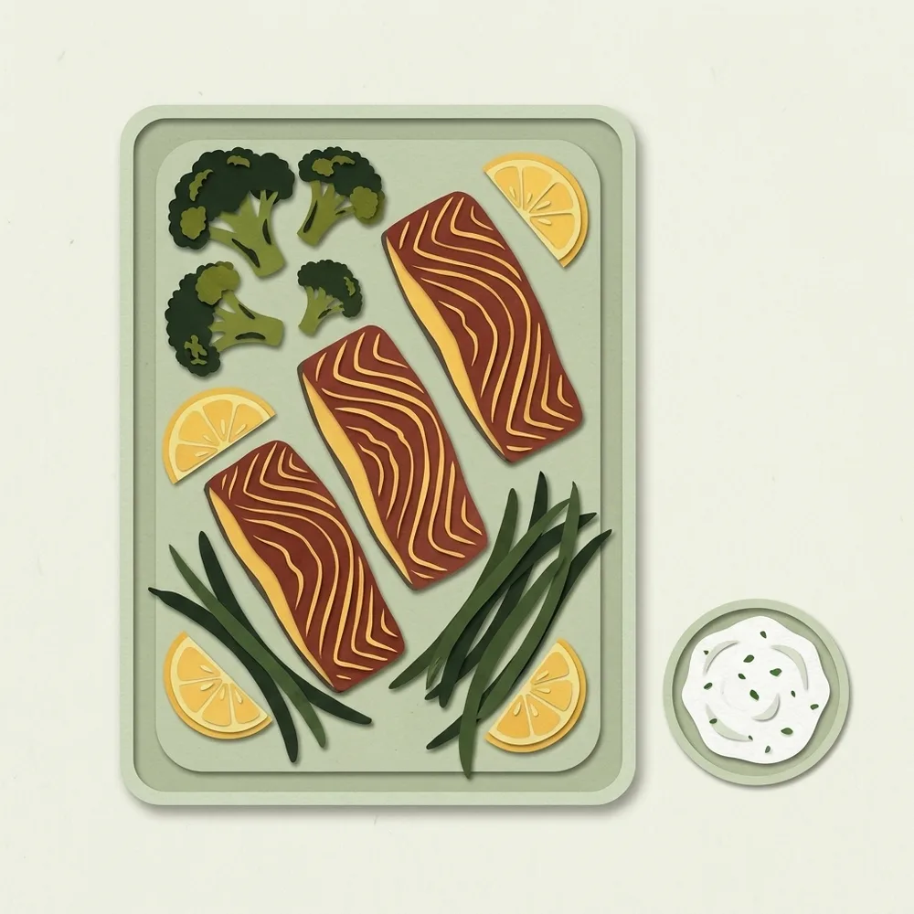 Een ovenschaal met zalmfilets, broccoliroosjes, sperziebonen en schijfjes citroen, met een bakje kruidenyoghurt